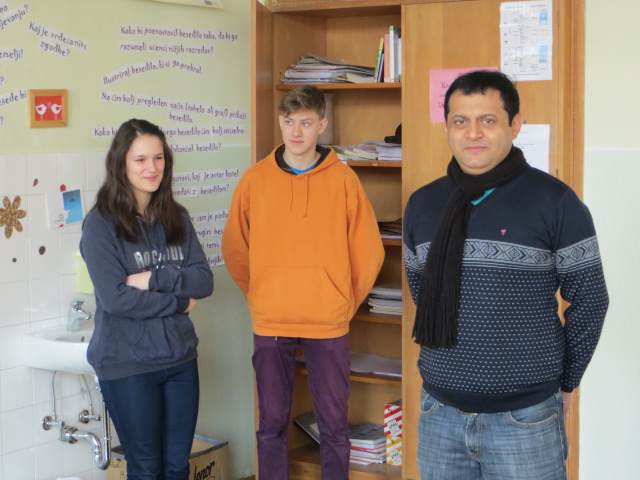Deepak Thimaya with students in an international classroom