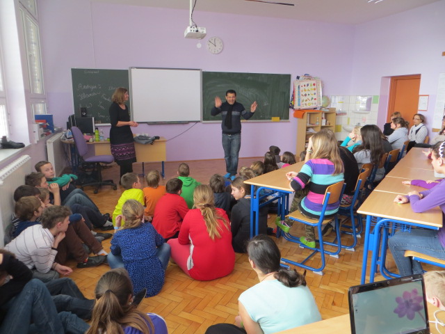 Deepak Thimaya leading a seated classroom discussion